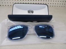 A pair of as new Lacoste sunglasses.