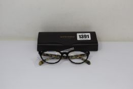 A pair of Oliver Peoples Arella glasses frames.