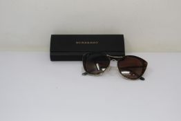 A pair of as new Burberry sunglasses.