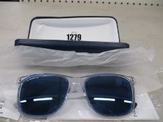 A pair of as new Lacoste sunglasses.