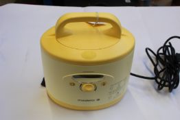 A Medela Symphony double electric breast pump (Unit and case only).