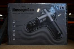 A boxed as new Lovopo Massage Gun.