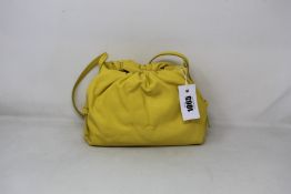 An as new S.Joon Baby Bao bag in yellow (RRP £395).