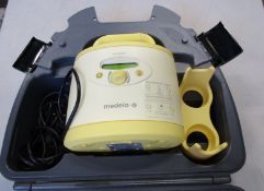 A Medela Symphony double breast pump (Unit only).