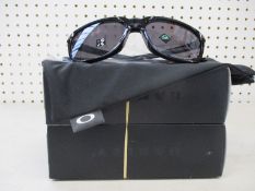 Two boxed of as new Oakley Anorak sunglasses polished black frame with prizm grey lenses (