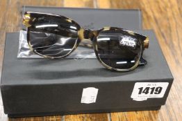 A pair of as new Persol sunglasses.