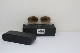 A pair of as new Persol sunglasses.