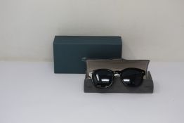 A pair of as new Oliver Peoples Cary Grant sunglasses.