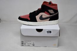A pair of women's as new Nike Air Jordan 1 Mid (UK 6).