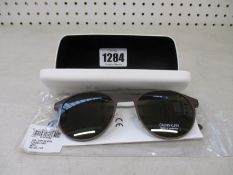 A pair of as new Calvin Klein sunglasses.