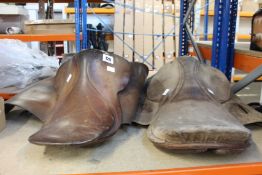Two pre-owned unbranded horse saddles.
