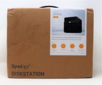 A boxed as new Synology DS420J 4-Bay Desktop NAS Enclosure (Box opened, some damage to box).