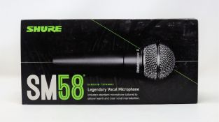 a boxed as new Shure SM58 vocal microphone in black/silver (box unsealed).