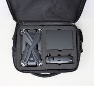 An as new WSJ MJX Bugs 4W GPS Folding Drone in carry bag with batty, charging dock and controller.