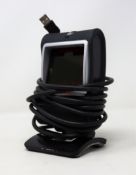 A pre-owned Honeywell Genesis 7580G-2 1D 2D USB Presentation Barcode Scanner.