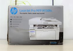 A boxed as new HP Jet Pro MFP M130fn multi-function laser printer in white (box damaged).