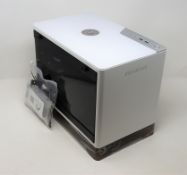 A boxed as new InWin A1 Plus computer case for ITX motherboards in white (box opened).