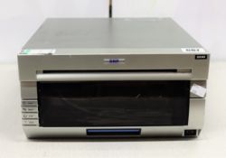 COLLECTION ONLY: A pre-owned DNP DS40 photo printer (Some cosmetic damage).