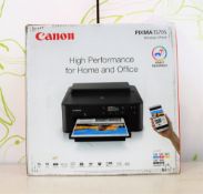 A boxed as new Canon PIXMA TS705 multi-function inkjet printer in black (box opened) (box damaged).