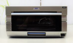 COLLECTION ONLY: A pre-owned DNP DS40 photo printer (Some cosmetic damage).