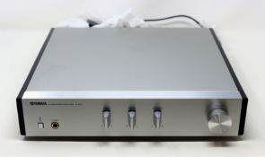 A pre-owned Yamaha A-670 Integrated Amplifier (Damage to top of casing and front edge. Powers on,
