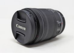 A pre-owned Canon 24-105mm F4-7.1 IS STM RF Lens (Lens caps included. Tested, working).