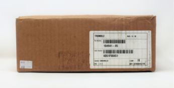 A pre-owned Trimble SNM941 Connected Site Gateway (M/N: SNM941-60 P/N: 104950-80) (Boxed).