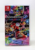 Four as new Mario Kart 8 Deluxe Nintendo Switch Game Cards (Packaging sealed).
