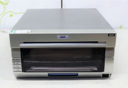 COLLECTION ONLY: A pre-owned DNP DS40 photo printer (Some cosmetic damage).