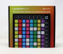A boxed as new Novation Launchpad X Grid Controller for Ableton Live.
