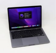 A boxed pre-owned 13