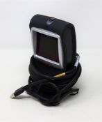 A pre-owned Honeywell Genesis 7580G-2 1D 2D USB Presentation Barcode Scanner.