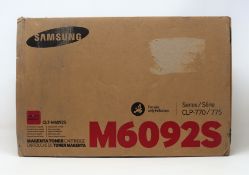 A boxed as new Samsung CLT-M6092S Magenta Toner Cartridge (Box sealed, some damage to box).