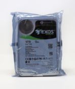 An as new Seagate ST12000NM002G Exos Enterprise X16 12TB SAS Hard Drive (Packaging sealed).