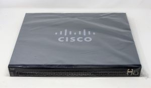 A boxed as new Cisco 24-port stackable managed switch in silver/black (PN: SG350XG-24F) (box opened)