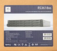 COLLECTION ONLY - A boxed as new Synology RS3618XS 12 Bay 8GB Diskless Rack NAS unit in silver/