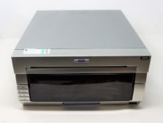COLLECTION ONLY: A pre-owned DNP DS40 photo printer.