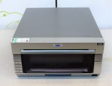 COLLECTION ONLY: A pre-owned DNP DS40 photo printer (Some cosmetic damage).