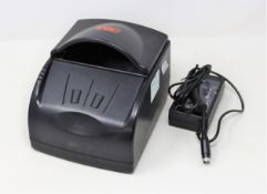 A pre-owned 3M AT9000 Passport/Full page ID Document Scanner (Power supply included).