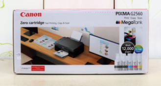 A boxed as new Canon PIXMA G2560 MegaTank all-in-one printer in black (box opened) (box damaged).