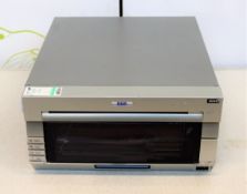 COLLECTION ONLY: A pre-owned DNP DS40 photo printer (Damage to front panel).