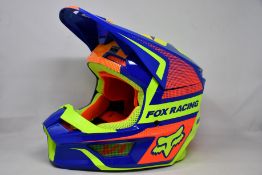 A boxed as new Fox Racing V1 Oktiv helmet in blue (Medium).