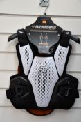 An as new Fox Raceframe Impact SB CE D30 Protector Vest in black/White (S/M).
