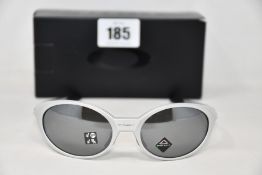 A boxed as new Oakley Eyejacket Redux Silver frame with prizm black polarized lenses (