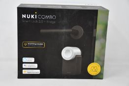 A boxed as new Nuki Combo smart lock 2.0 plus bridge.