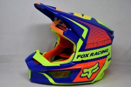 A boxed as new Fox Racing V1 Oktiv helmet in blue (Small).