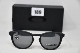 A box as new pair of Oakley Pitchman R glasses Satin Black frame with Prizm Black Polarized
