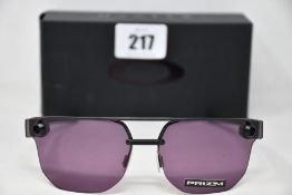Two boxed as new Oakley Chrystl matte black frame with prizm indigo lenses (888392427021).
