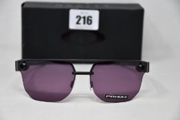 Two boxed as new Oakley Chrystl matte black frame with prizm indigo lenses (888392427021).