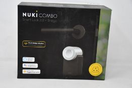 A boxed as new Nuki Combo smart lock 2.0 plus bridge.